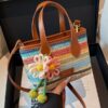 O1CN01TU6P671WEIgwYzO2Q_2221436032756-0-cib.jpg Cross-border rainbow woven floral women's handbag, 2026 new fashionable forest-style vacation crossbody bag, multifunctional straw woven bag