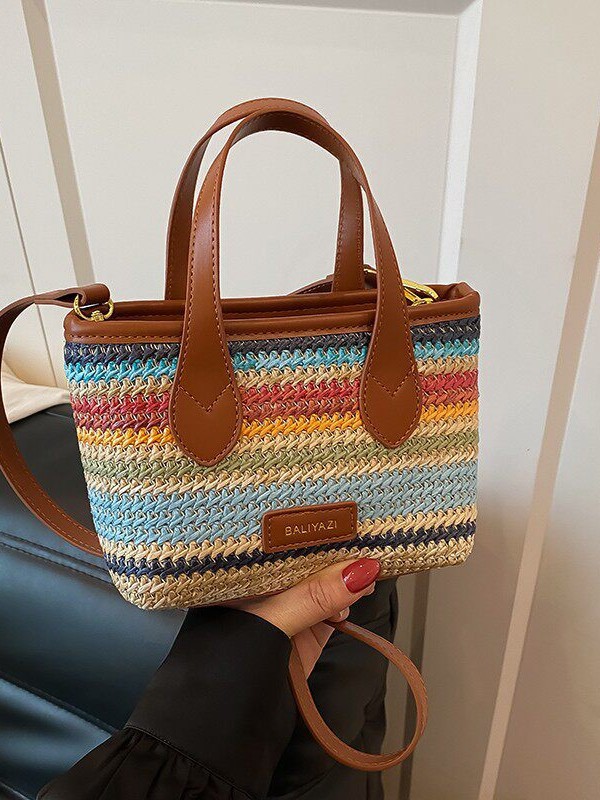 O1CN01huk9ln1WEIgwi5vyU_2221436032756-0-cib.jpg Cross-border rainbow woven floral women's handbag, 2026 new fashionable forest-style vacation crossbody bag, multifunctional straw woven bag